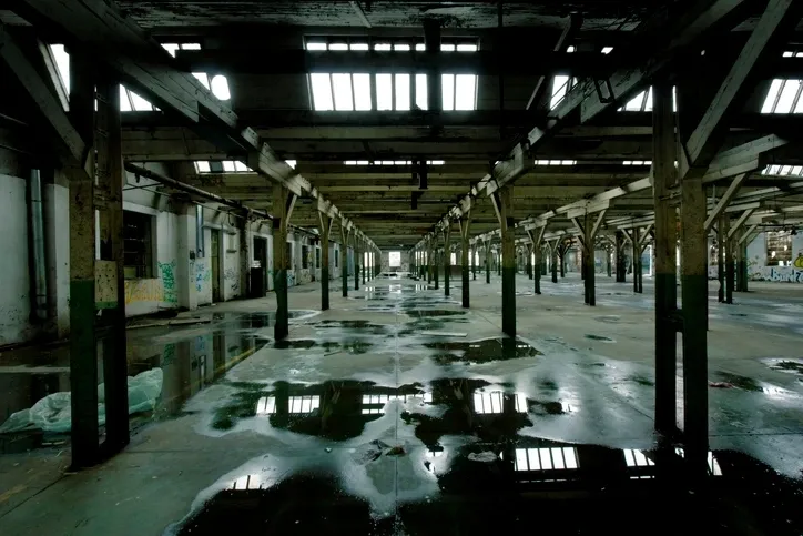 What are the consequences of a leaking commercial roof?